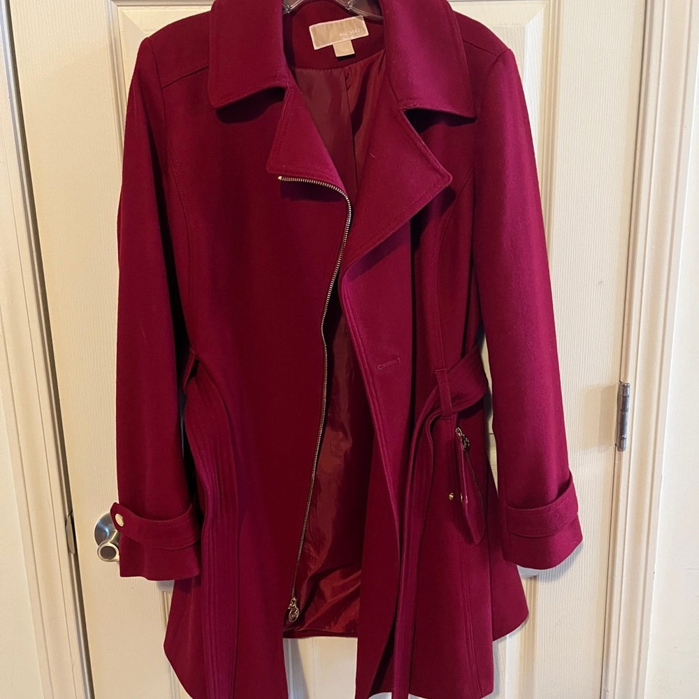 Michael Kors dark red wool coat with gold hardware and belt.